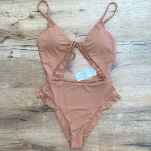 Dippin’ Daisy’s pink ruffle one piece